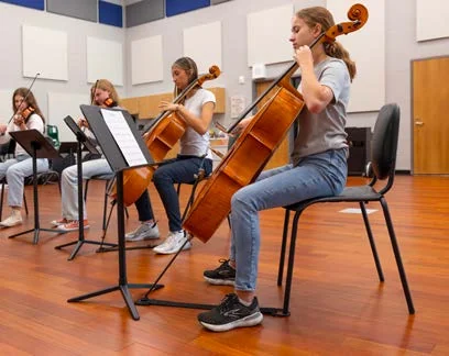 Students using Wenger chairs and stands in orchestra rehearsal
