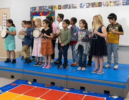 Students performing on flipFORMS classroom risers